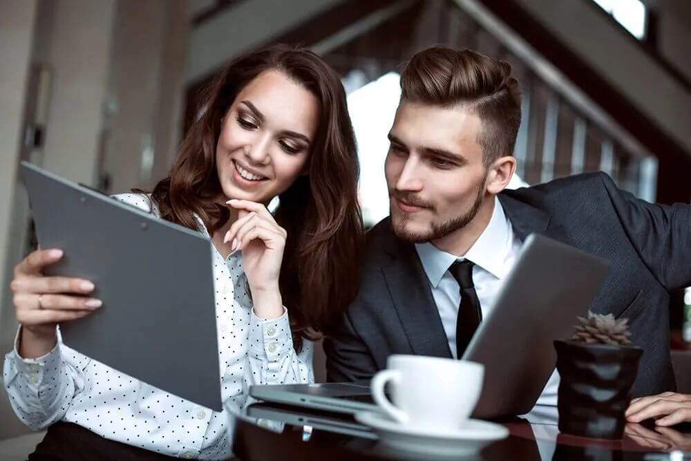 Penple looking at a clipboard